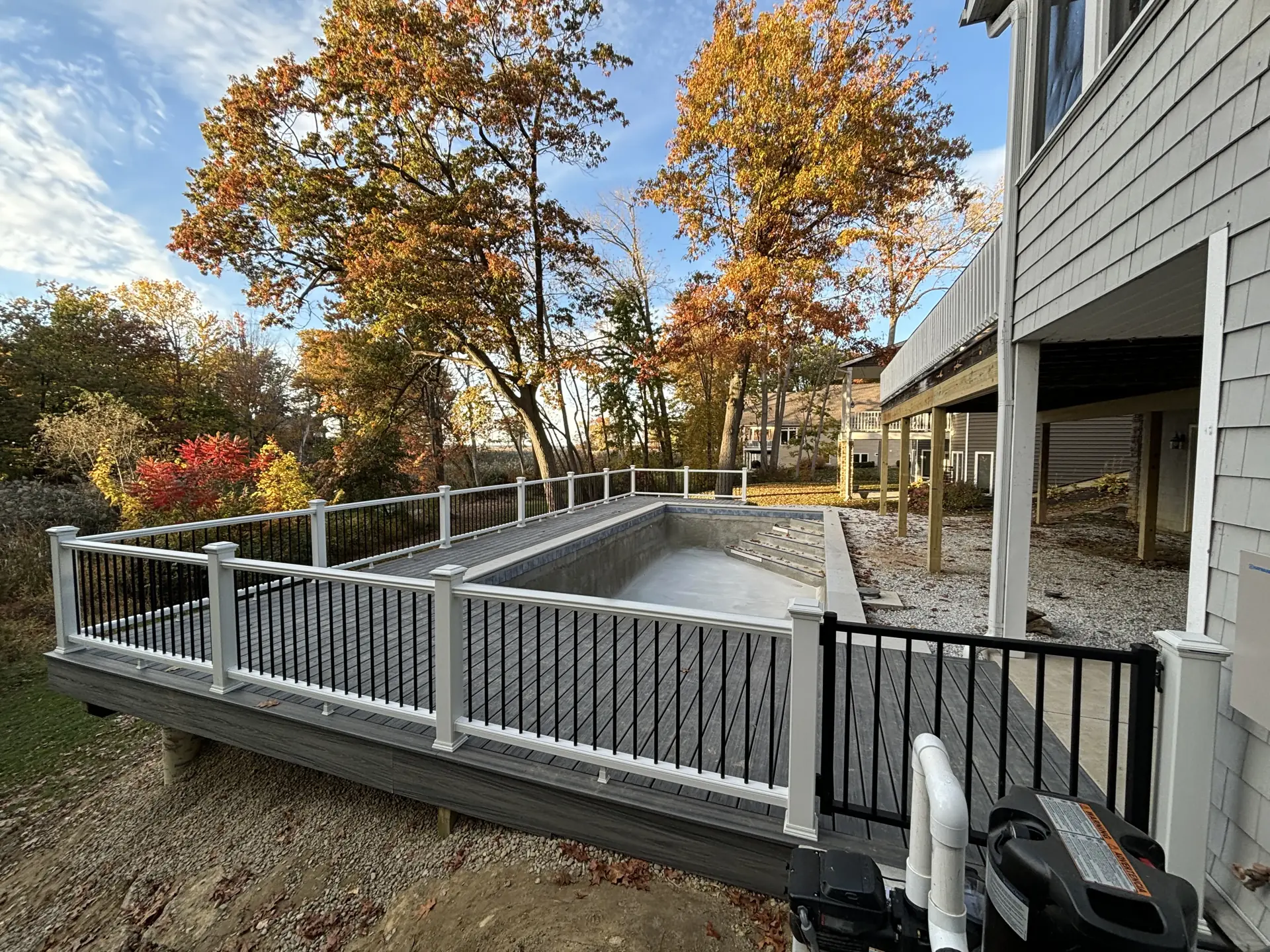 Deck wrapping around pool and house